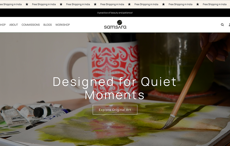 Homepage of the Samsara art store with the headline "Designed for Quiet Moments," over a watercolor painting in progress with a brush, paint tubes and a patterned mug.